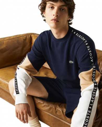 felpa navy da uomo con maniche beige/bianche e logo stripes | LACOSTE