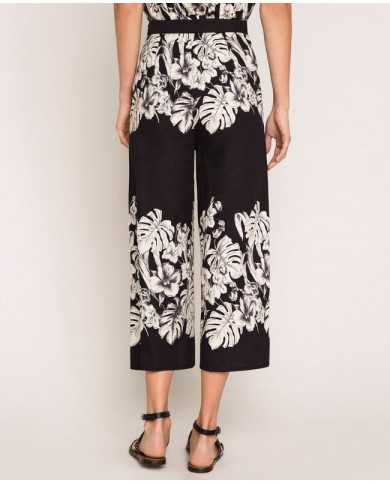 Pantaloni cropped ampi grafico nero donna con stampa a fiori | TWINSET Pantaloni cropped ampi grafico nero donna con stampa a fiori | TWINSET